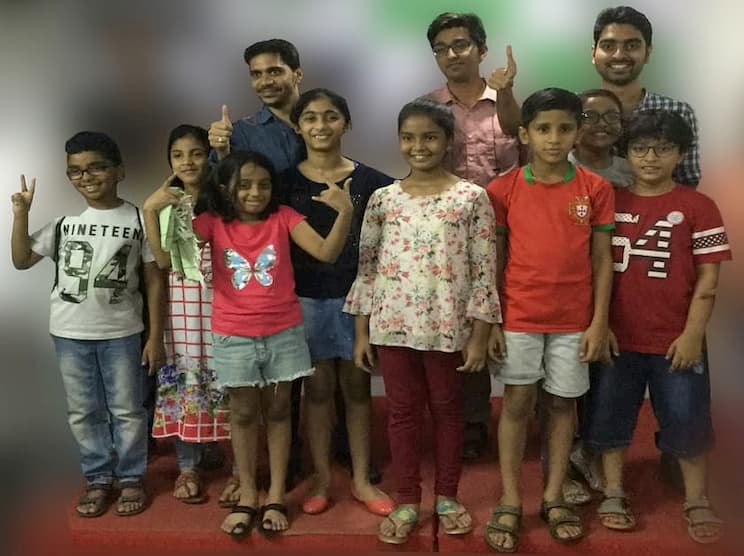 Kids with smiley face along with trainer Revanth Kanakam at Best Public Speaking Training Courses in Hyderabad,Visakhapatnam.